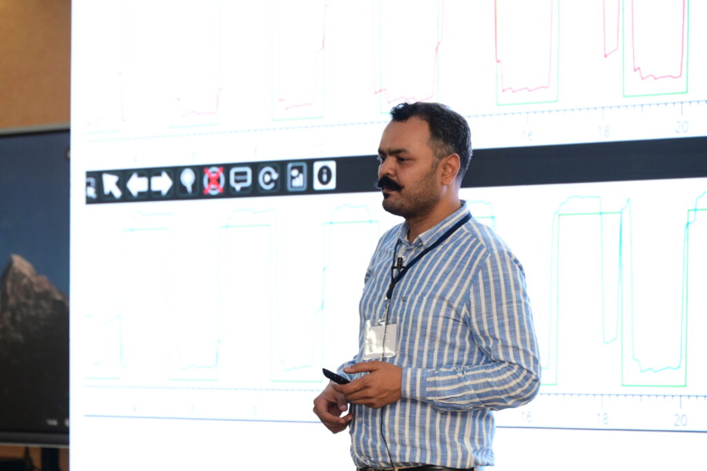 Dr. Prateek Porwal presenting clinical material at the International Balance Symposium, Yenepoya University — BPPV and vertigo specialist