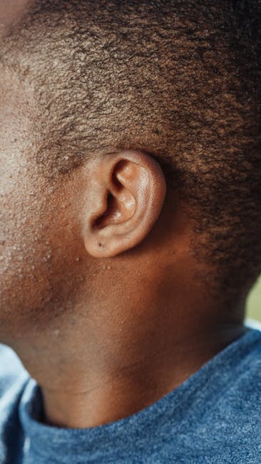 Close-up of a person's external ear and side of head — acoustic neuroma symptoms | Dr. Prateek Porwal, ENT