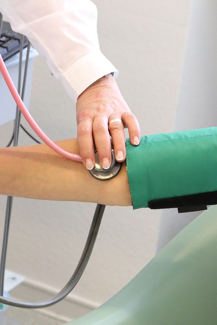Doctor taking blood pressure with stethoscope and cuff — Types of Vertigo | Dr. Prateek Porwal, ENT