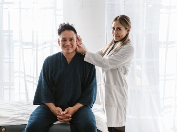 Doctor examining patient's ear with a tool — BPPV म्हणजे काय | Dr. Prateek Porwal, ENT