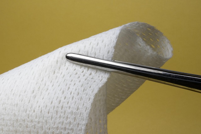 Surgical gauze held by forceps against a yellow background — bppv recurrence | Dr. Prateek Porwal, ENT