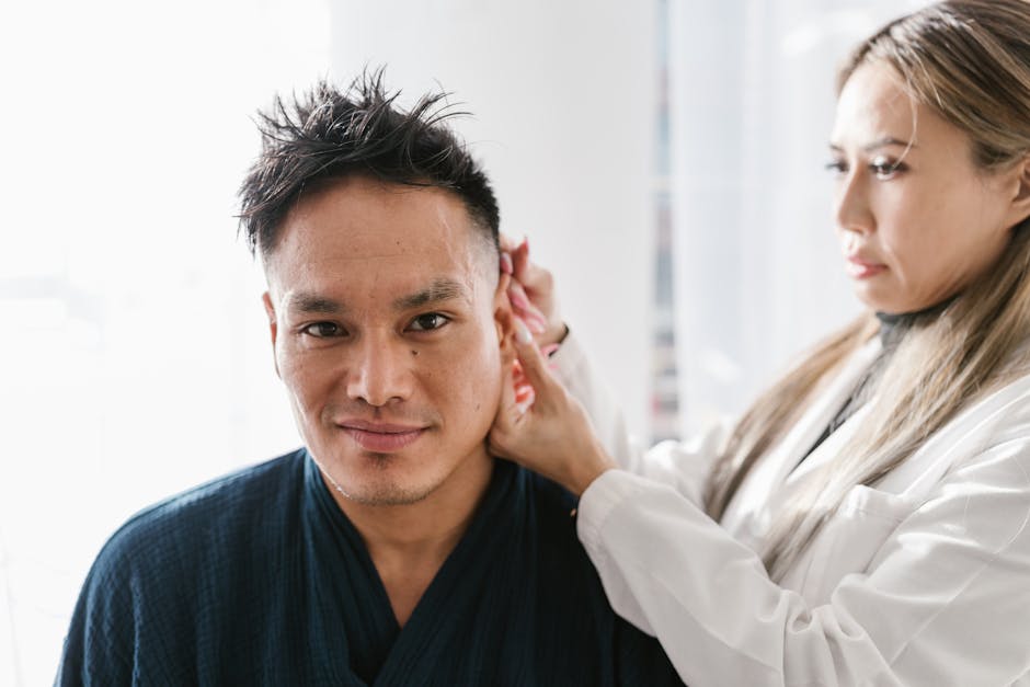 Doctor examining a patient's ear — ચક્કરના ઘરેલુ ઉપચાર | Dr. Prateek Porwal, ENT
