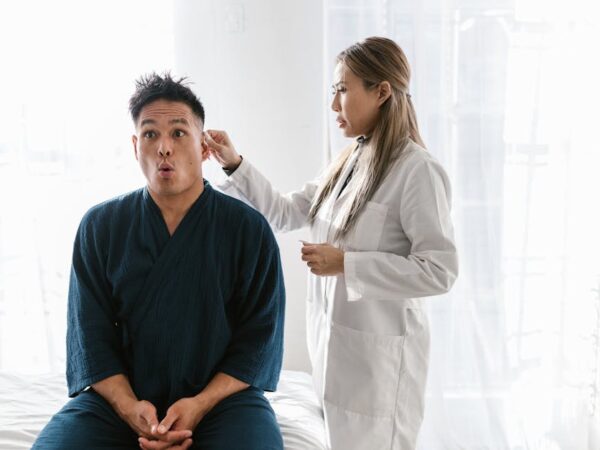 Doctor examining patient's ear with a cotton swab — चक्कर येण्यावर घरगुती उपाय | Dr. Prateek Porwal, ENT