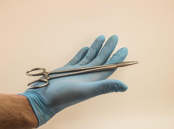 Hand in blue glove holding surgical forceps — चक्कर की दवा | Dr. Prateek Porwal, ENT