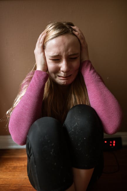 Young girl crying with hands over ears, distressed — चिंता आणि चक्कर | Dr. Prateek Porwal, ENT