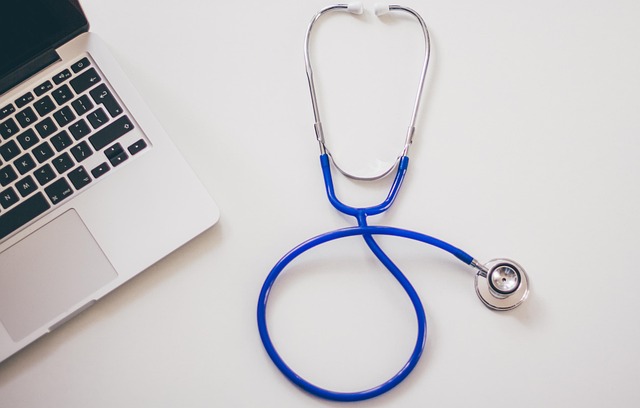 Stethoscope and laptop on a white surface, medical theme — ENT Specialist Pilibhit | Dr. Prateek Porwal, ENT