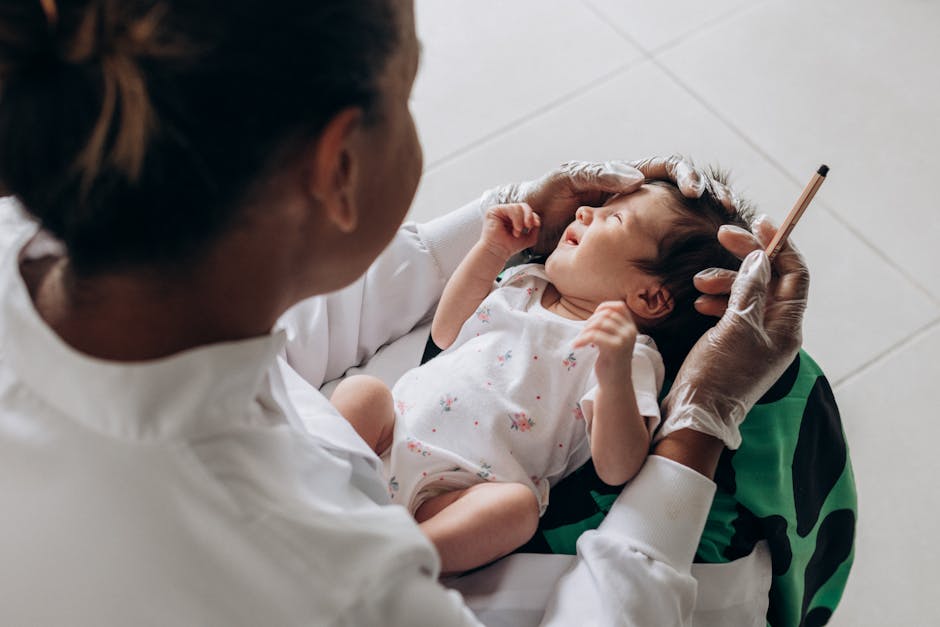 Doctor examines a baby's ear with a tool — গর্ভাবস্থায় মাথা ঘোরা | Dr. Prateek Porwal, ENT