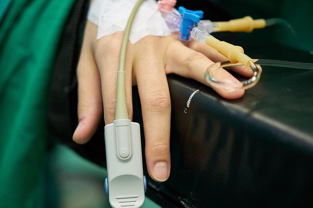 Patient's hand with pulse oximeter and IV lines — vertigo history | Dr. Prateek Porwal, ENT