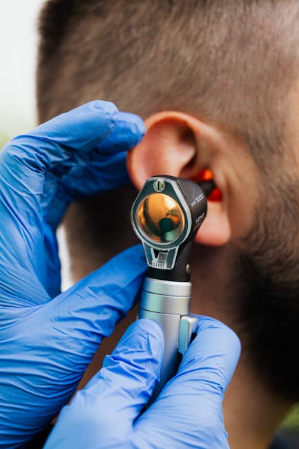 Doctor examining ear with otoscope, close-up view — labyrinthitis complete guide | Dr. Prateek Porwal, ENT