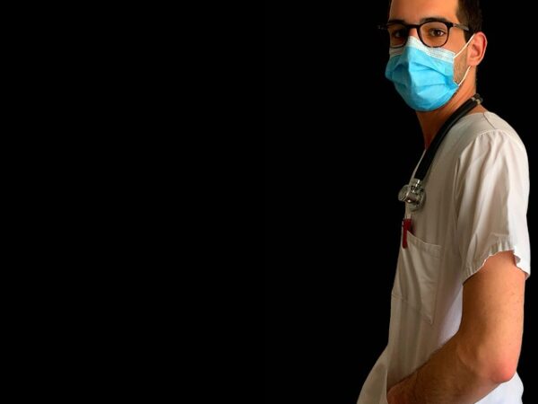 Doctor wearing a mask and stethoscope, looking to the side — mal de debarquement syndrome | Dr. Prateek Porwal, ENT