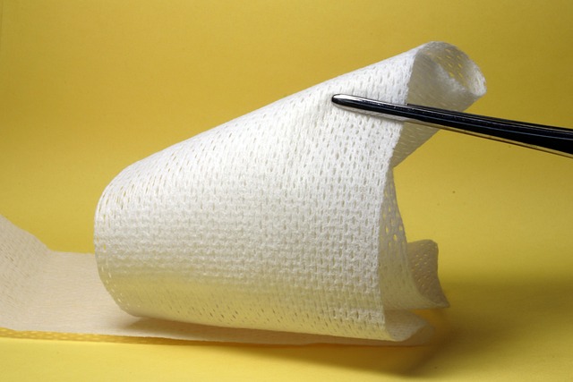 Medical gauze roll held by forceps against yellow background — মাথা ঘোরায় কখন | Dr. Prateek Porwal, ENT