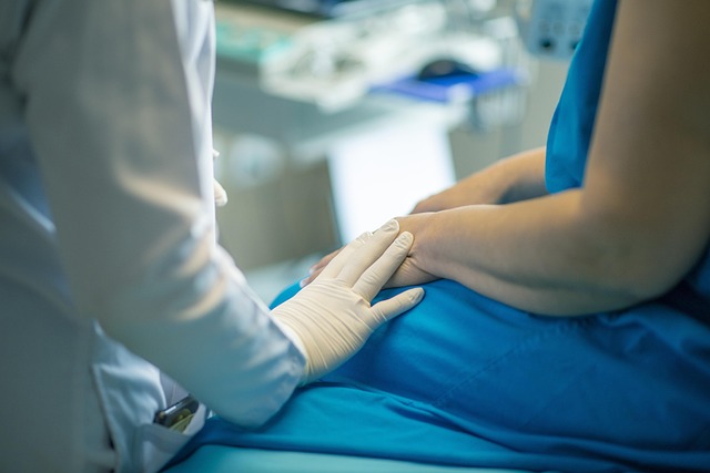 Doctor in gloves comforting patient with hand on arm — মেনিয়ার রোগ | Dr. Prateek Porwal, ENT