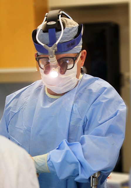 Surgeon wearing loupes and headlamp during a medical procedure — otosclerosis treatment | Dr. Prateek Porwal, ENT