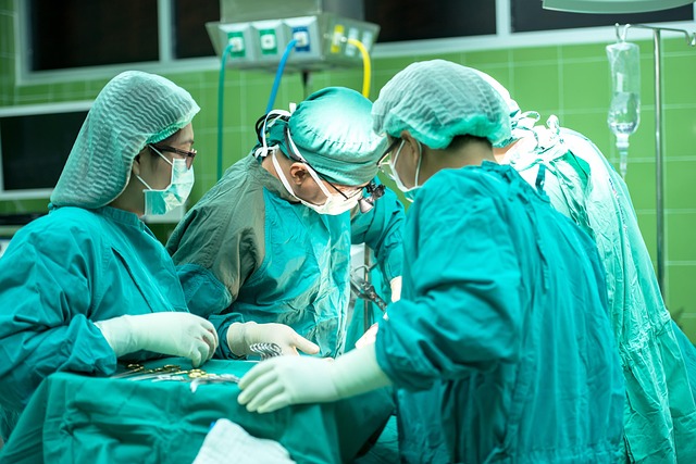 Surgeons in operating room performing surgery with medical instruments — Vertigo Specialist Bangal… | Dr. Prateek Porwal, ENT