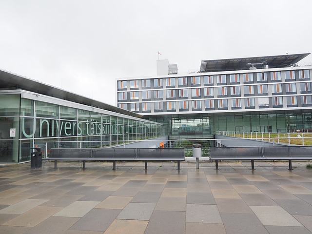 Exterior of a modern university hospital building with benches — Vertigo Doctor in Farrukhabad | Dr. Prateek Porwal, ENT