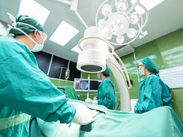 Surgeons in operating room with medical equipment and monitors — Vertigo Specialist Mumbai | Dr. Prateek Porwal, ENT