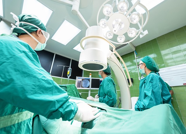 Surgeons in operating room with medical equipment and monitors — Vertigo Specialist Mumbai | Dr. Prateek Porwal, ENT