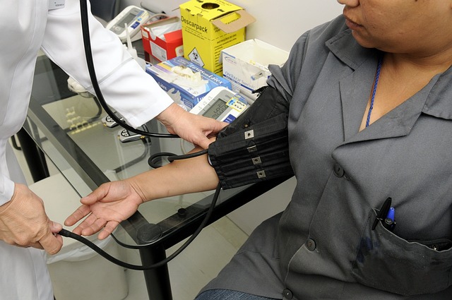 Doctor taking patient's blood pressure with a cuff — vertigo consultation pune | Dr. Prateek Porwal, ENT
