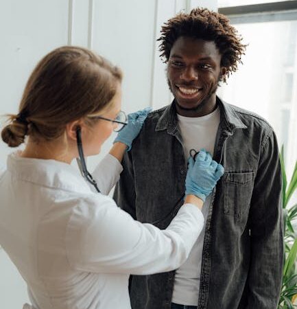 Doctor using stethoscope to listen to patient's chest — Vertigo specialist for Bangalore patients | Dr. Prateek Porwal, ENT