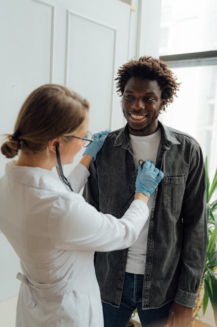 Doctor using stethoscope to listen to patient's chest — Vertigo specialist for Bangalore patients | Dr. Prateek Porwal, ENT