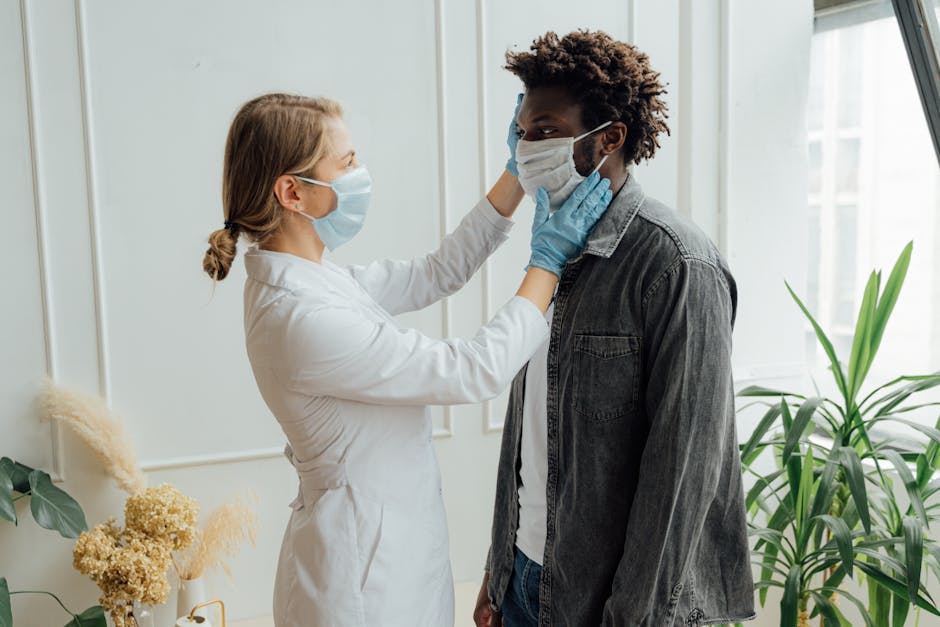 Doctor adjusting patient's face mask for protection — Vertigo specialist for Chennai patients | Dr. Prateek Porwal, ENT