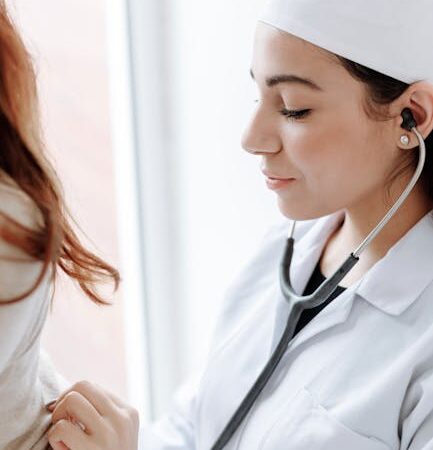 Doctor using stethoscope on a patient's chest — Vertigo specialist for Delhi patients | Dr. Prateek Porwal, ENT