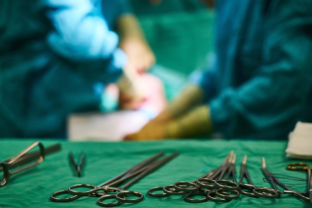Surgical instruments on a green cloth with blurred surgeons in background — Vertigo Doctor in Ghaz… | Dr. Prateek Porwal, ENT