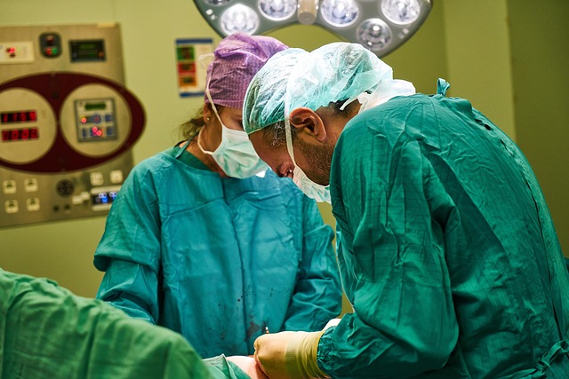 Surgeons in operating room performing a procedure with medical equipment — Vertigo Doctor in Lakhi… | Dr. Prateek Porwal, ENT