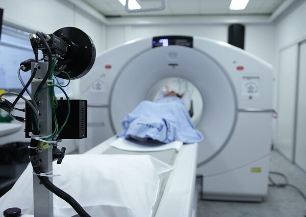 Patient undergoing CT scan with specialized equipment in foreground — Vertigo Doctor in Prayagraj | Dr. Prateek Porwal, ENT