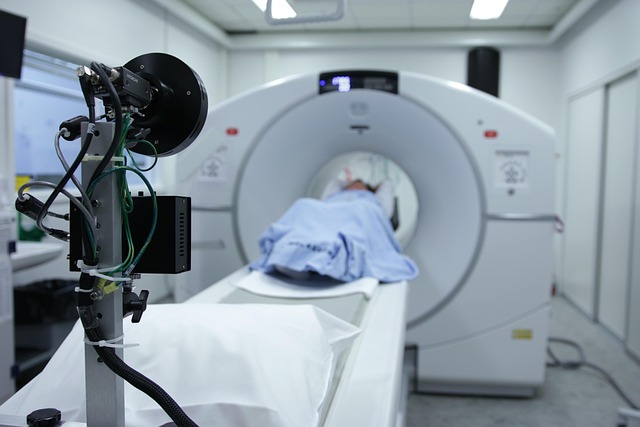 Patient undergoing CT scan with specialized equipment in foreground — Vertigo Doctor in Prayagraj | Dr. Prateek Porwal, ENT