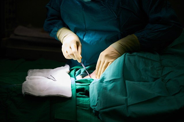 Surgeon's hands performing a medical procedure with surgical instruments — Vertigo Doctor in Unnao | Dr. Prateek Porwal, ENT