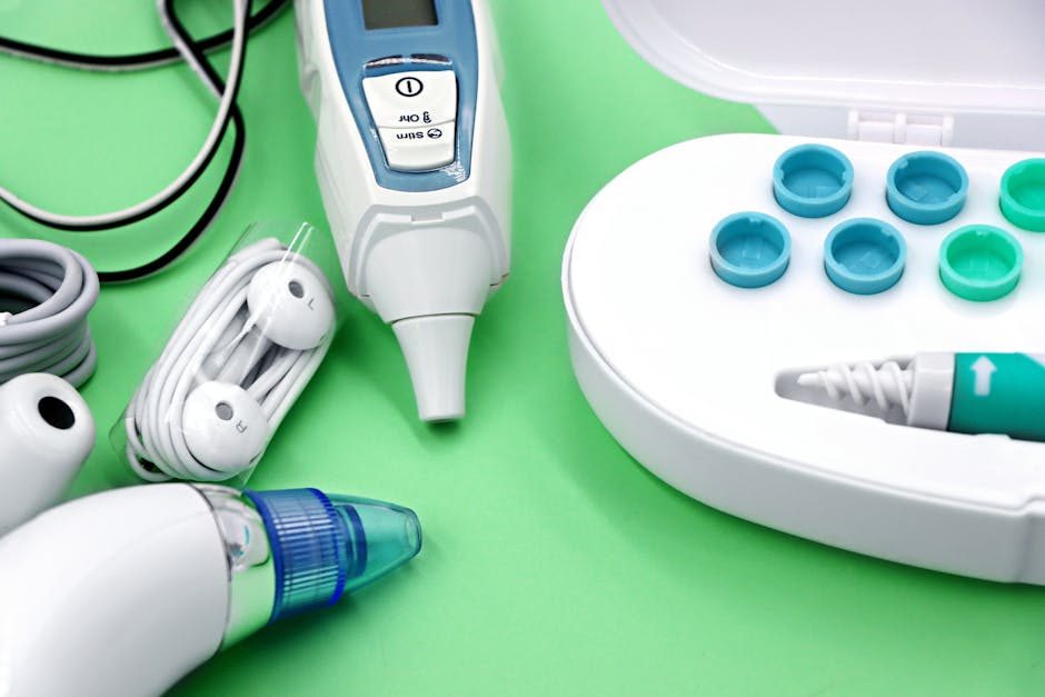 Medical thermometer, ear swabs, and nasal aspirator on green background — Vertigo in Women Over | Dr. Prateek Porwal, ENT