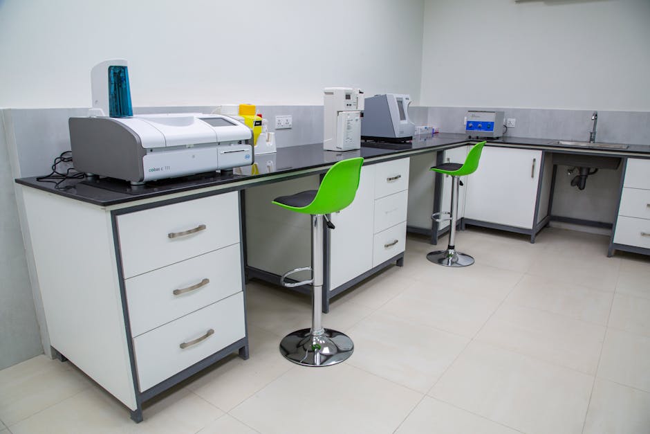 Laboratory equipment with analyzers, stools, and sink — vng टेस्ट चक्कर | Dr. Prateek Porwal, ENT